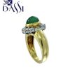 Anello in oro bicolore 18kt con diamanti e smeraldo