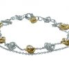 Bracciale morbido in oro bicolore 18kt con diamanti e fiori
